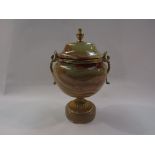 An onyx and gilt urn of small proportions with lid,