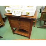 A circa 1920 walnut two tier work table of three drawers on square tapering reeded legs (inlaid