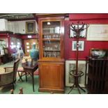 A Victorian mahogany pier bookcase on base the single glazed door and adjustable height shelves