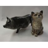 A Doulton pot bellied pig and a Beswick tabby cat