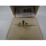 An 18ct gold emerald and diamond set lady's ring. Size L/M, 3.