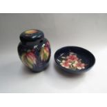 A Moorcroft ginger jar (a/f) and bowl (2) 22cm diameter and 22cm tall