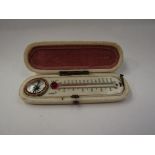 A 19th Century ivory cased thermometer and compass set