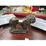 A figure of a lion on plinth base,