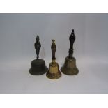 Three hand bells including figural examples