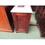 An Edwardian mahogany marble top night cabinet with single door and shaped apron,