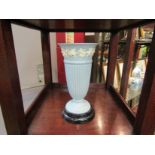 A Wedgwood embossed fluted vase on pedestal base,