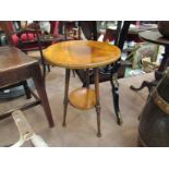 A fruitwood circular top occasional table on ring-turned supports to under-tier,