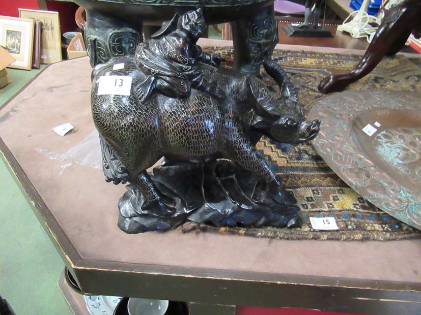 A pair of 19th Century Chinese silver inlaid carved hardwood water buffalo carrying baby buddhas,