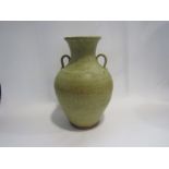 A large studio pottery urn form vase, twin lug handles, oatmeal glaze,