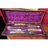 A cased silver mounted horn carving set
