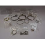 Eleven pairs of eleven silver earrings and five silver bracelets