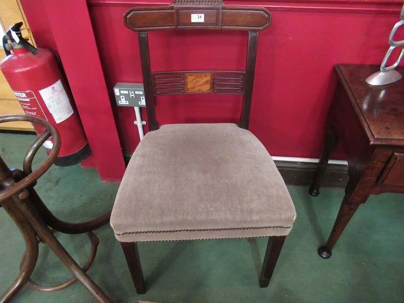 A pair of George III carved mahogany chairs with inlaid panelled pierced back rests on square