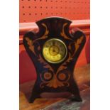An inlaid mahogany mantel clock with wind-up American table clock