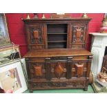 An 18th Century oak and walnut veneer court cupboard with linen fold side panels,