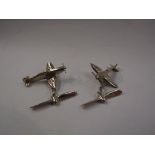 A pair of silver hallmarked cufflinks in the form of spitfires,
