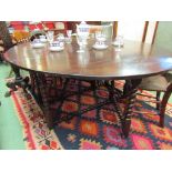 A Charles II and later oak oval top gate-leg dining table,