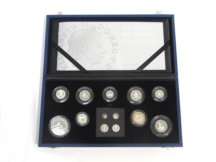 A cased Royal Mint silver proof coin set "The Queen's 80th Birthday Collection" includng £5, £2, £1,