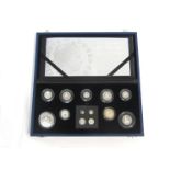 A cased Royal Mint silver proof coin set "The Queen's 80th Birthday Collection" includng £5, £2, £1,