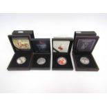 Four silver proof cased coins including Battle of Hastings and VE Day anniversary