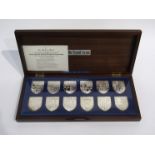 The Danbury Mint "The Royal Arms" collection of 12 silver ingots,