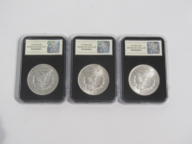Three US silver Morgan dollars, Philadelphia, cased and boxed, - Image 2 of 3
