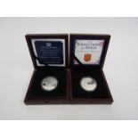 Two cased £5 coins in silver proof for the Bailiwicks of Jersey and Guernsey celebrating the Queens