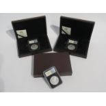 Three US silver Morgan dollars, Philadelphia, cased and boxed,