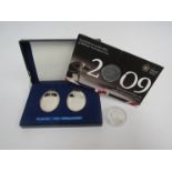 A pair of Elizabeth II 1952-1977 Silver Jubilee medallions together with an XXX Olympic silver £5