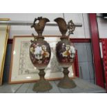 A pair of floral design ewers,