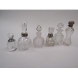 A selection of glass scent bottles with stoppers including silver neck examples (6)