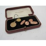 A pair of gold cufflinks etc