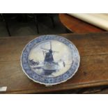 A 20th Century Delft charger with windmill design,