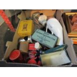 A box of bygone medical equipment including bottles and tins