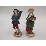 A pair of Continental porcelain figures of man and woman, cross mark to base, 1128,