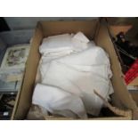 A box of white linen napkins,