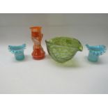 An iridescent green art glass pourer bowl,