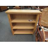An oak three shelf bookcase,