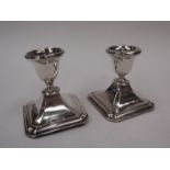 A pair of squat form candlesticks, marked Birmingham,