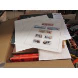 A box containing a collection of stamp sheets including Falklands and Tristan da Cunha,