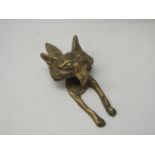 A brass door knocker in the form of a fox