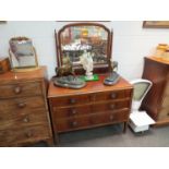 A 1930's walnut dressing chest, the mirror back over two short and two long drawers,