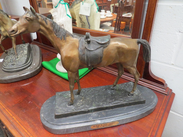 A cold cast bronze model of horse with side saddle by J Moigniez on marble stand, signature to base,
