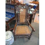 Two 18th Century and later carver chairs with decorative carved crests, barley-twist supports,