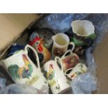 A box of mixed ceramics including decorative jugs and Villeroy and Boch lidded container
