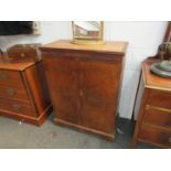 A burr walnut musical cabinet with sectional interior,