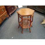 A pair of bamboo side tables with undertiers on outswept feet