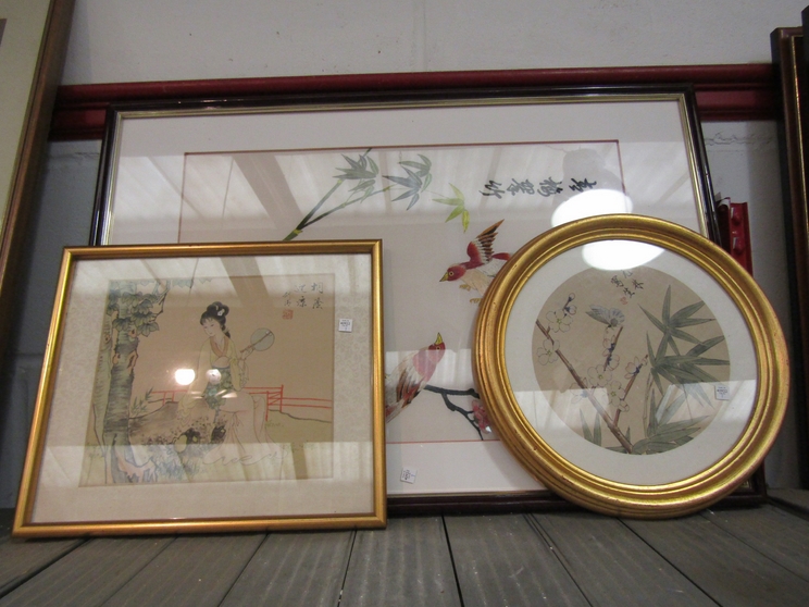 An Oriental silk embroidery of birds in foliage and two paintings on silk of Geisha and butterfly