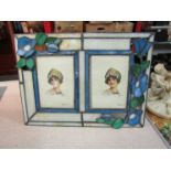 An Art Deco style twin picture frame with blue floral design,