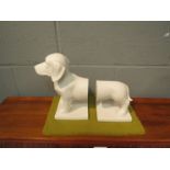 A pair of ceramic boookends in the form of a dog